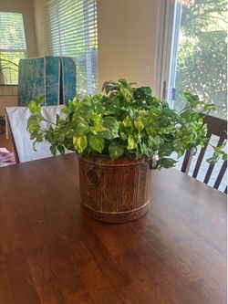 artificial plant in metal planter