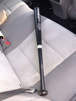 2 Baseballs and a wooden Bat