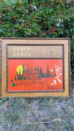 Chuck Seal wall clock with a country setting