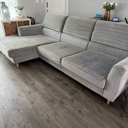 Oversized modern L shaped sectional coach with adjustable backrest.  Light grey