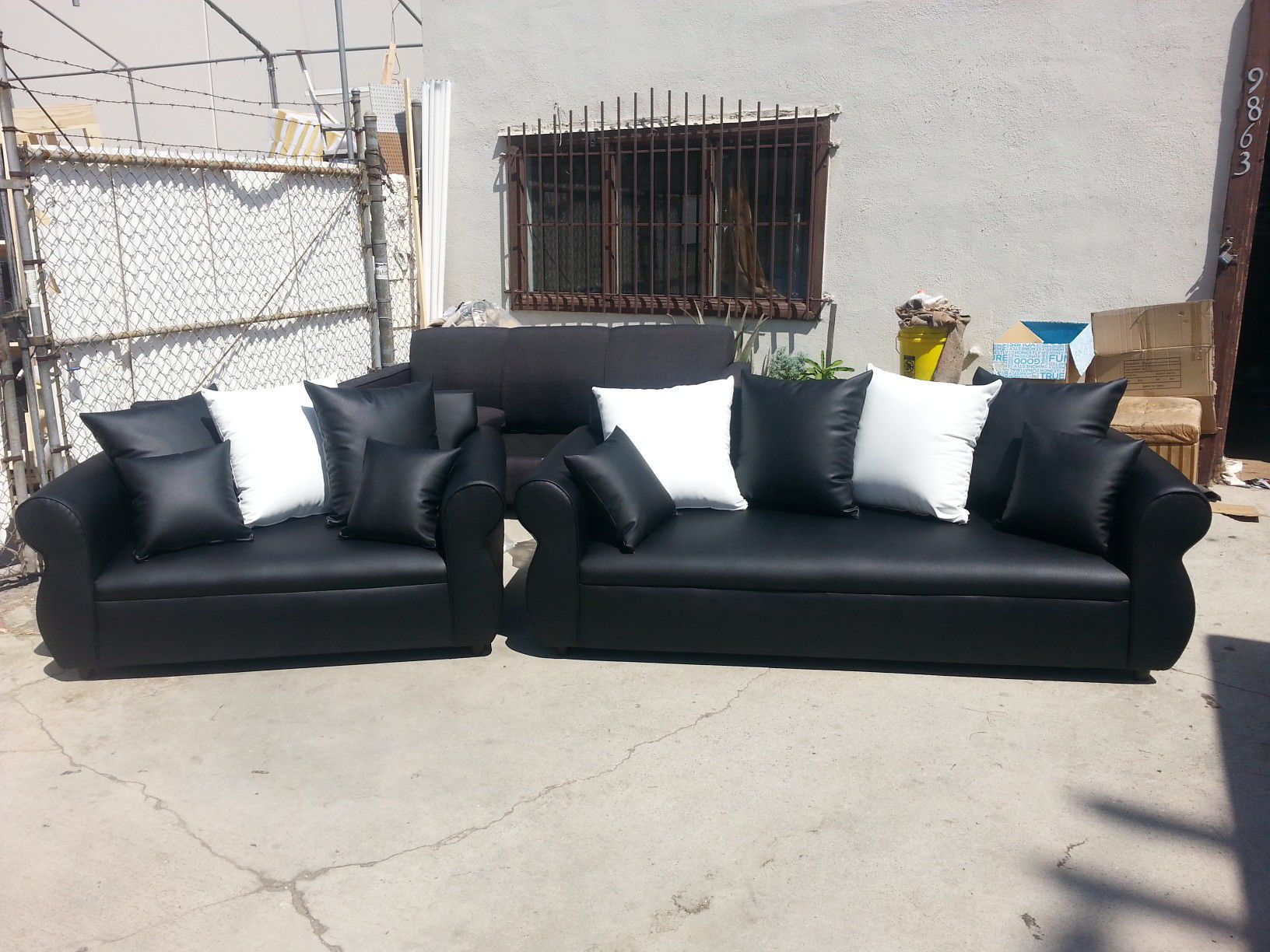 NEW BLACK LEATHER COUCHES