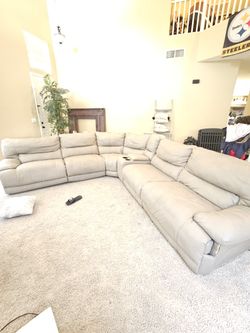 Leather Sectional Couch that reclines with Storage