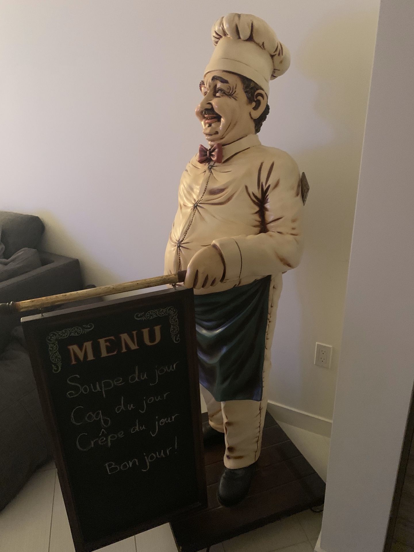 Chef cook with menu statue