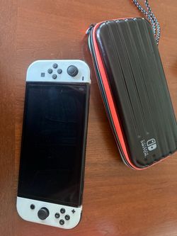 Nintendo Switch OLED Bundle + 4 Games