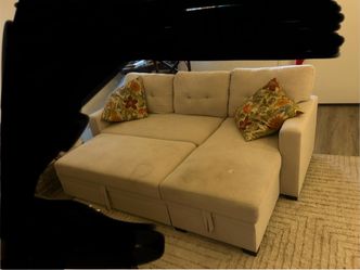 Beige sofa/ couch with pullout bed and storage
