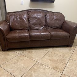 Brown Leather sofa With Chairs, Tables, and Lamps