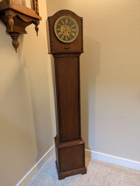 100+ years old small standing granddaughter / grandmother antique clock 53 inches tall with French movement. Has been running