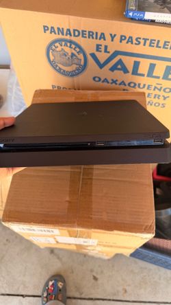 Play station 4 slim console with games and cables