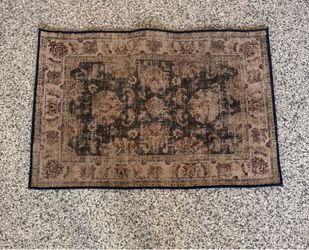 Small Persian style medallion area rug