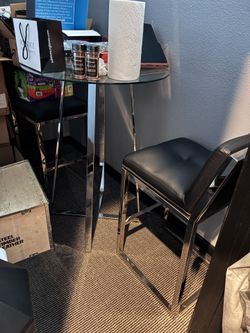 Glass and chrome bistro table with barstools