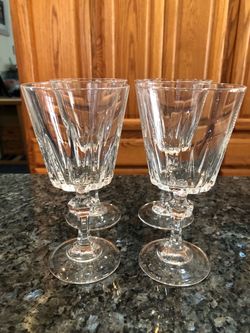 Vintage Elegant lot of 4 Crystal Wine Glasses. With a pretty stem etched . Size 6 inches tall and 3 inches wide across the rim. Capacity 4 ounces