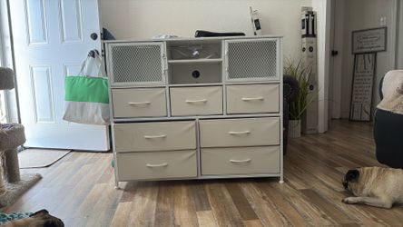 Small white dresser with plug