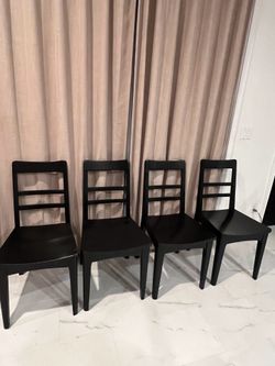 4 Black wooden dining chairs