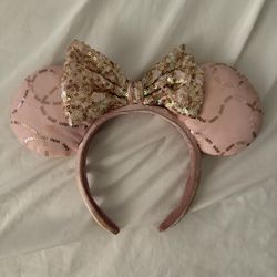 $10 Disney Parks Bibbidi Bobbidi Boutique Minnie Mouse Ears Headband, featuring pink padded ears with gold sequin accents and an oversized gold sequin