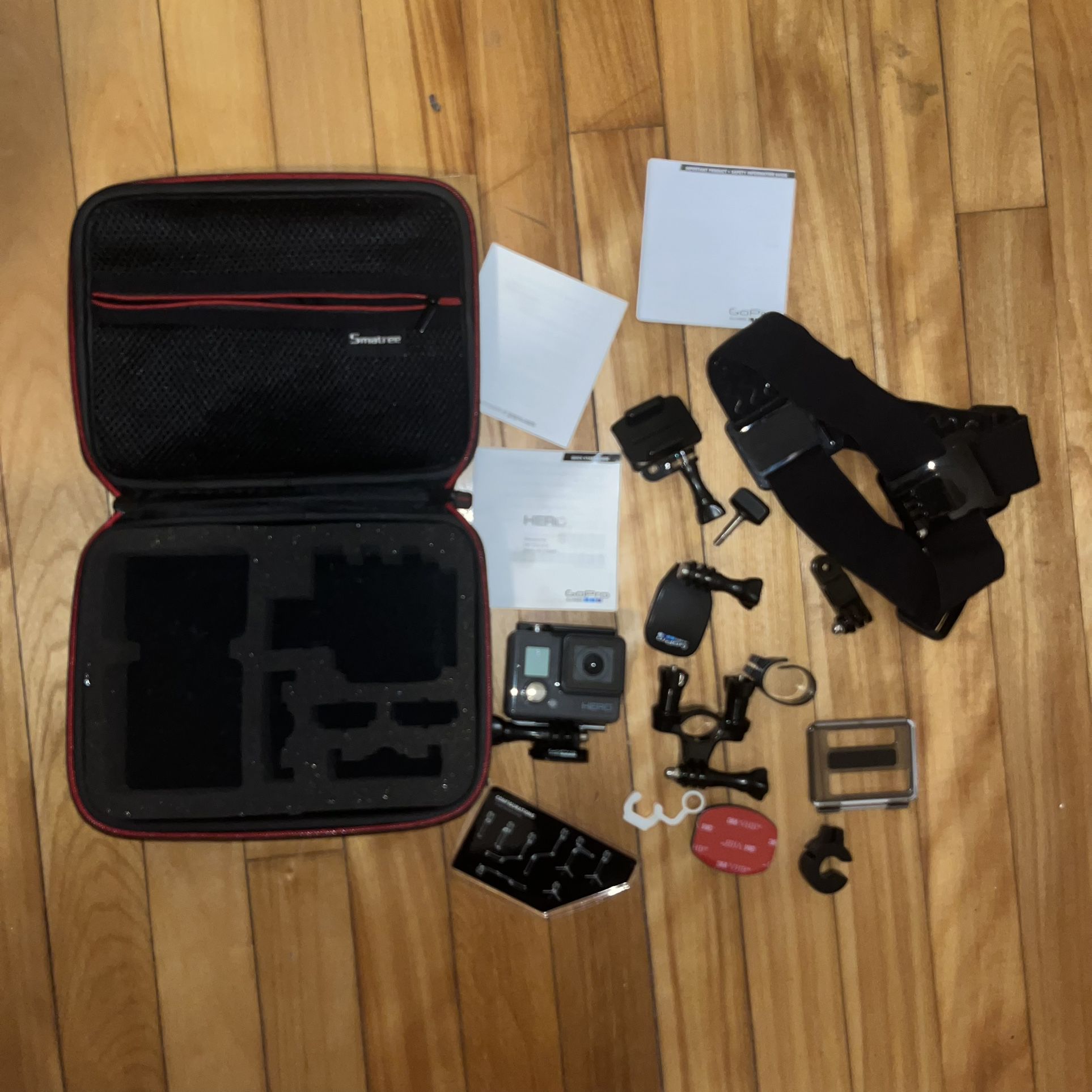 GoPro Hero Camera With Case, Strap, And Misc Accessories 