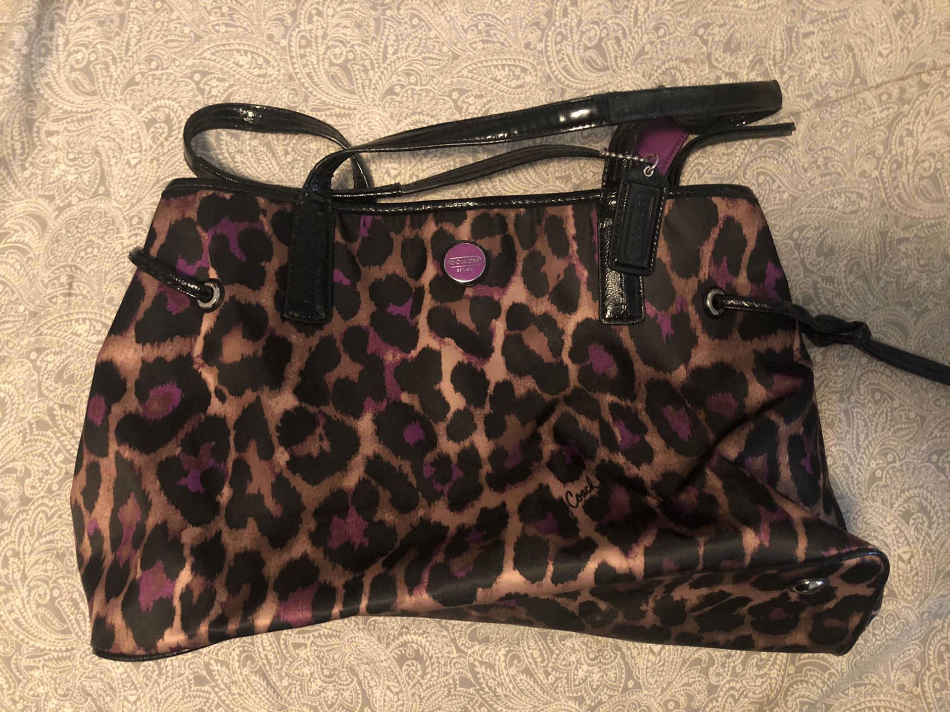 Coach leopard or cheetah print with hints of purple