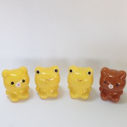 Four frog and teddy bear piggy banks