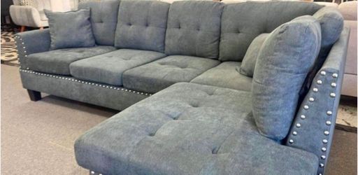 sectional sofa with 2 accent pillows. Comes new in 2 boxes