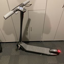 New / Excellent Condition UNAGI Scooter With Travel Bag And Lock!!!!