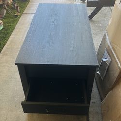 Coffee table black 3 drawer top nds up extends up