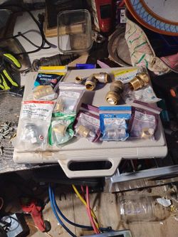 11 Pieces Of Random Plumbing Products Four Of Them Are Shark Bites There's A Straight Gas Ball Valve Half Inch Angle Stop Hex Nipples