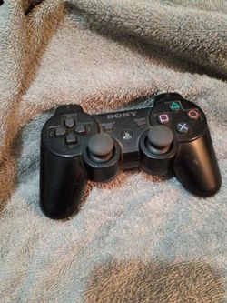 Black Sony PlayStation controller PS3