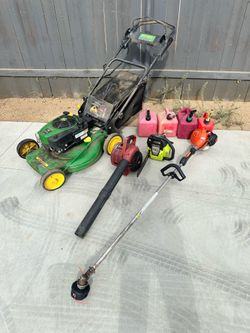 Yard tools weed eater, chainsaw, blower lawn mower and fuel jugs $200 pick up only