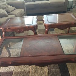 Solid Wood Coffeee Table with Matching Two End Tables. Coffee Table measures 21 x 53 x 21. End Table measures 21 x 22 x 26 approx. Minor scratches.
