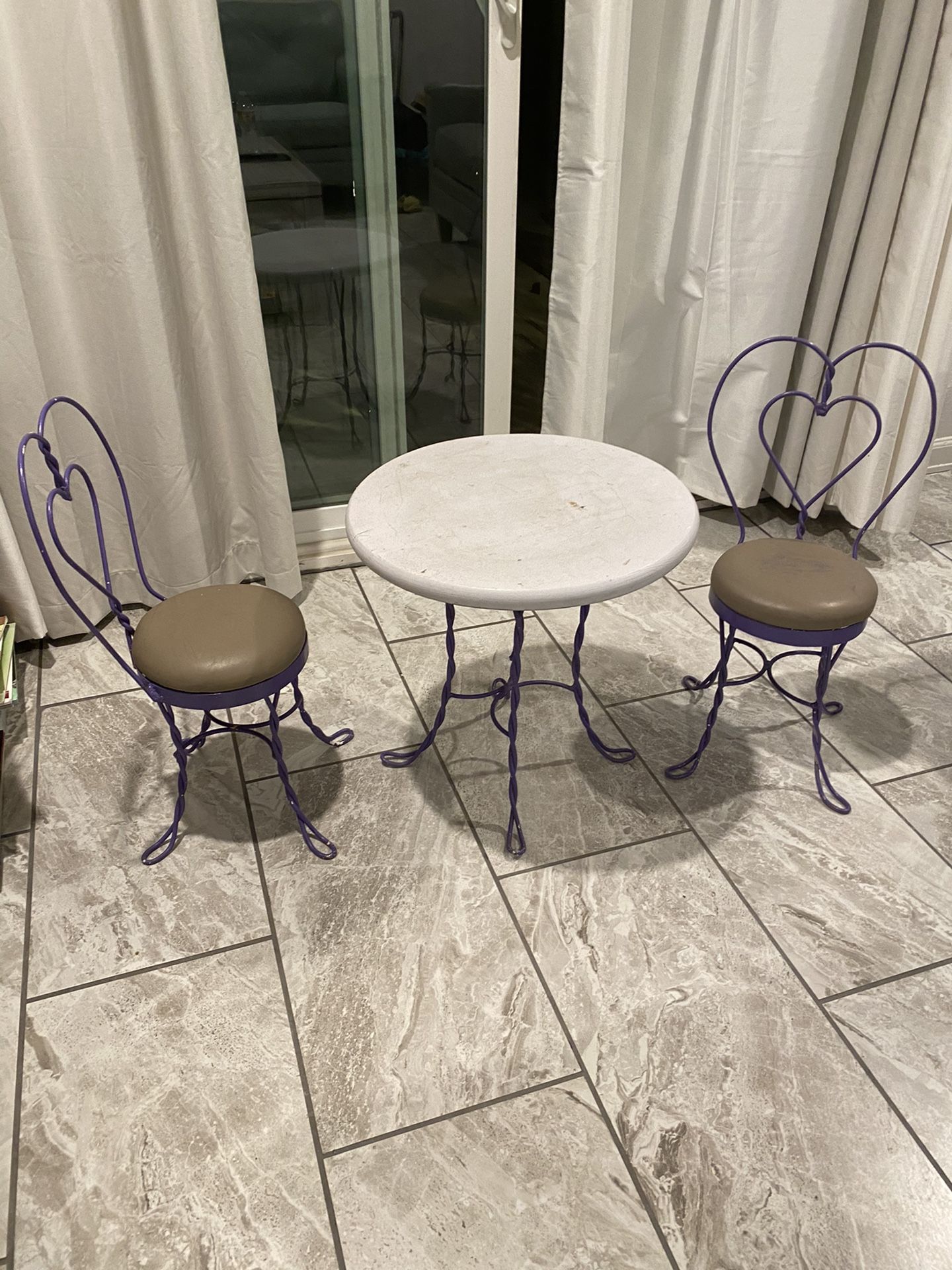 Antique Purple Rod iron table and 2 chairs