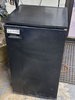 Uline Black Mini Refrigerator with top Freezer and bottom vegetable  tray used in good conditio