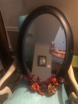 Wall mirror, 31 inches, with decorative flowers