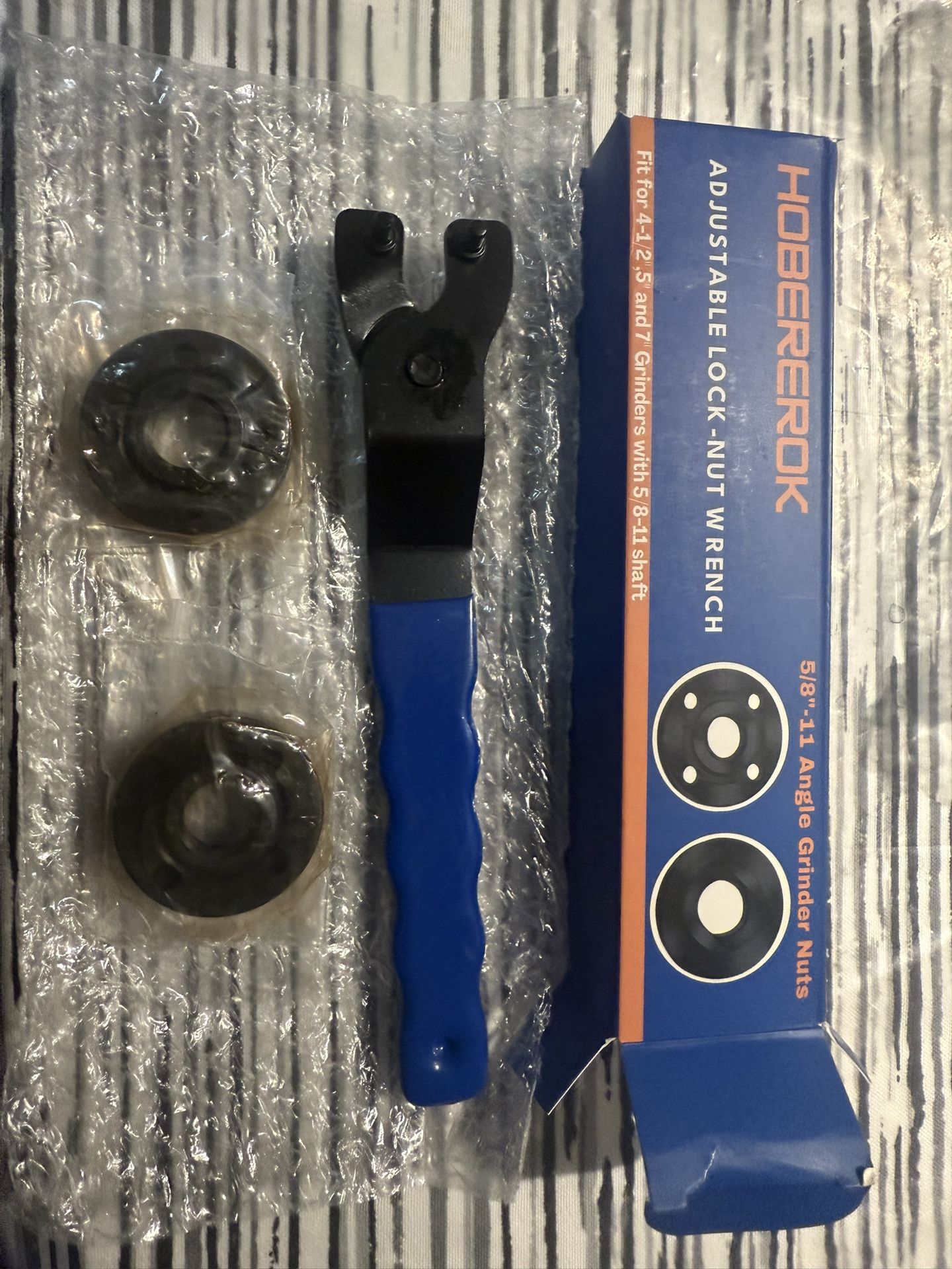 adjustable Grinder wrench and 2 sets of grinder nuts fits most 4 1/2 and 7” grinders new $15 in n Lakeland