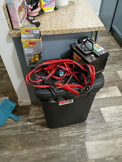 Battery, battery charger and jumper cables