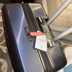 $120 Extra large lockable hard shell suitcase on wheels brand new never used plastic and tags still on it. Downsizing extras- got last year never used