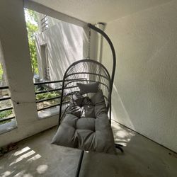 Egg Chair With A Plush Seat And Pillow