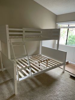 Twin/full bunk bed. Tax included . Free local delivery .  $350 for bunk bed only. $550 with mattresses.  Assembly required. Assembly not included. Cas