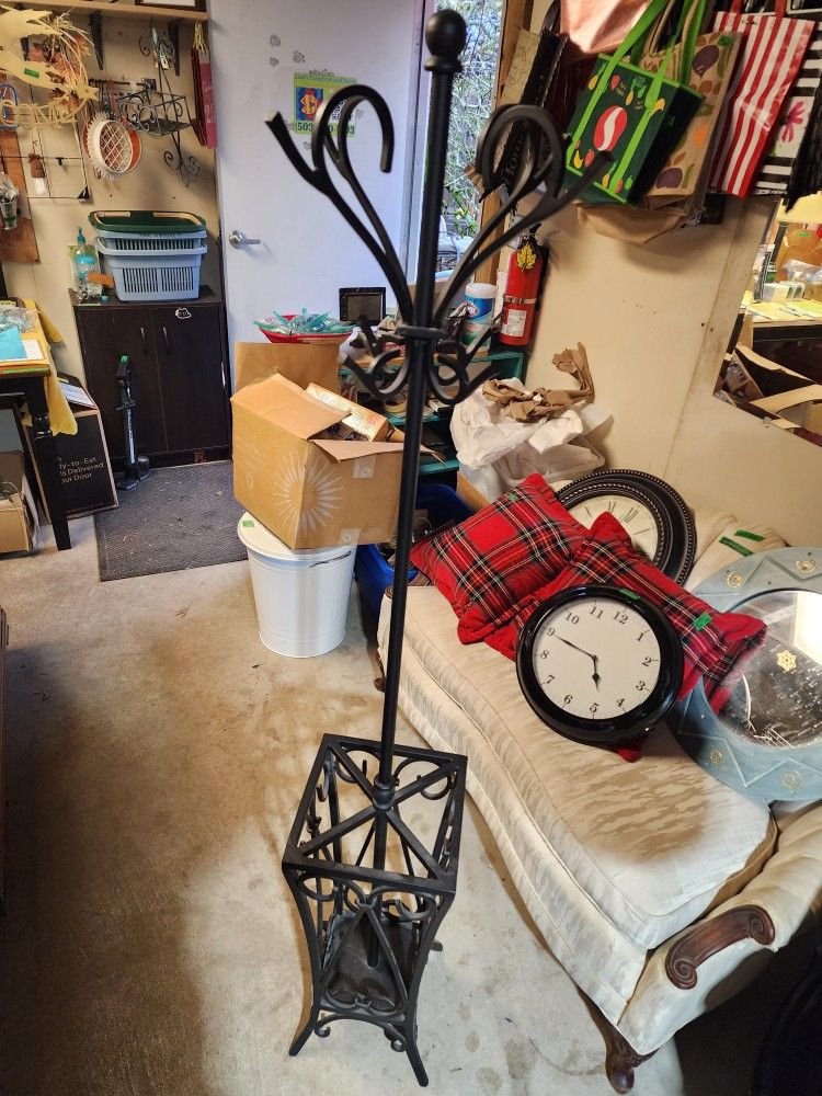 Black cast iron coat rack umbrella stand combo.
Very heavy
69"h x 12.5" w 