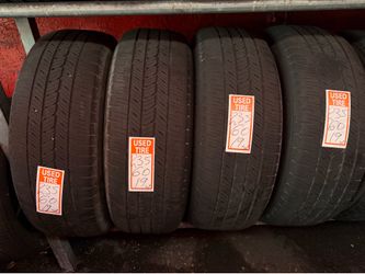 used set of four Bridgestone tires in size 235/60R19.
