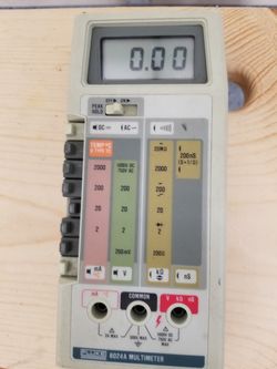 Fluke 8024A Multimeter with case and two sets of test leads and a companion Model Y8101 AC Current Transformer, test leads and instruction booklet.