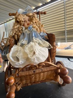 Wicker stroller with doll