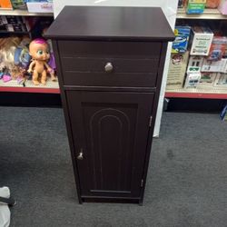 Small cabinet fits almost anywhere has three shelves and a drawer 14x12x34"H