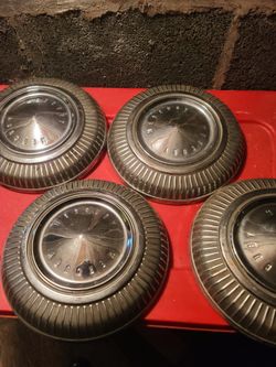 4  Mercury hub caps