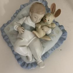 Lladro "Taking a Snooze" #6791, boy holding bunny sleeping on pillow, retired