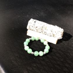 jade bracelet , 1 palo santo and 1 sage