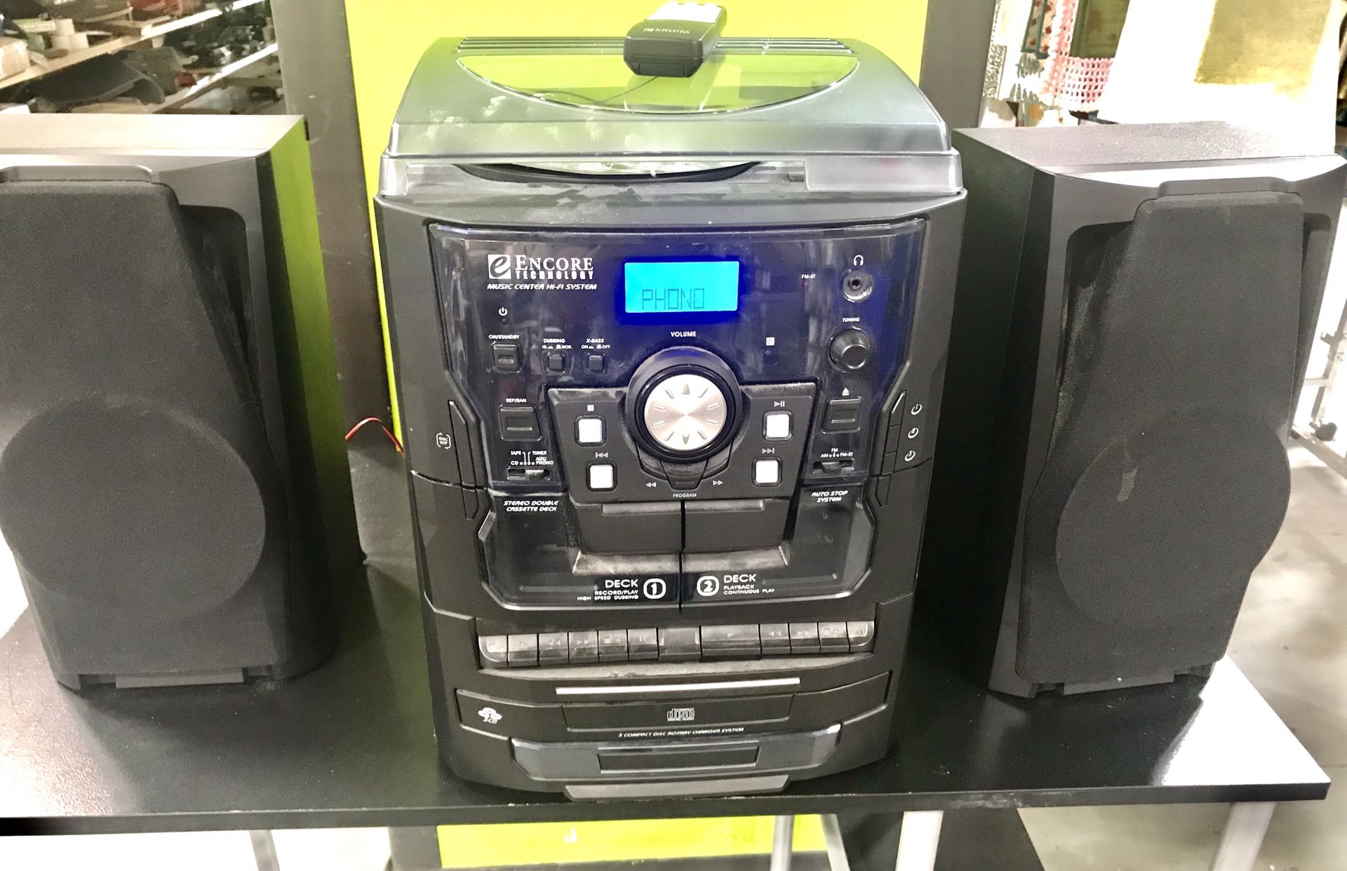 A COMPLETE STEREO WITH TURNTABLE,3 CD PLAYER,MP3,CASSETTE,RADIO WITH REMOTE CONTROL