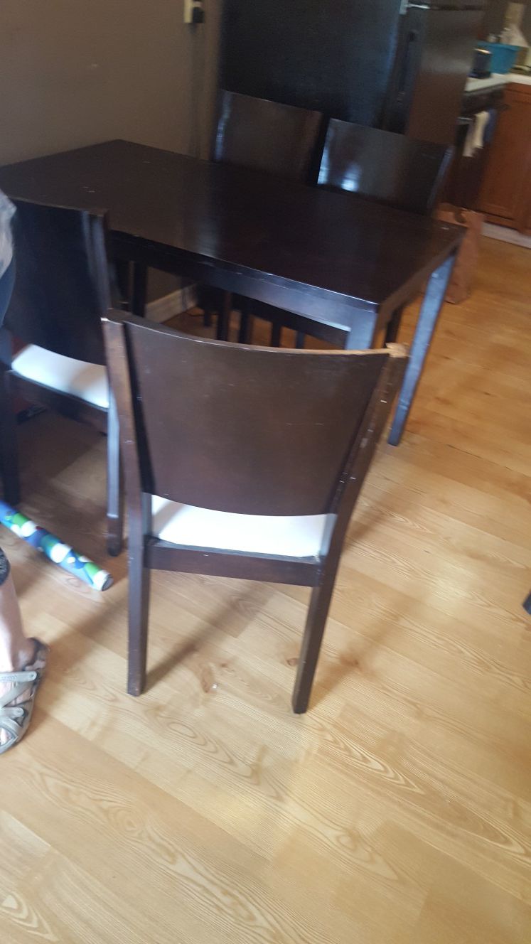 Wooden small dining, or big kitchen table with 4 chairs.