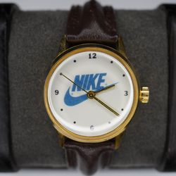 Vintage 1990s Nike Swoosh Logo Men's Quartz Watch Gold Tone White Dial Leather Band