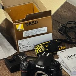 Nikon D850 digital camera body with box, strap, battery and charger.