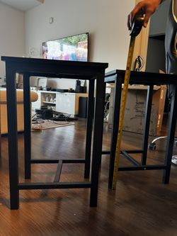 TWO black counter stools