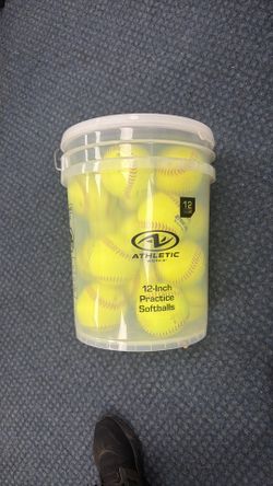 Bucket of lightly used softballs